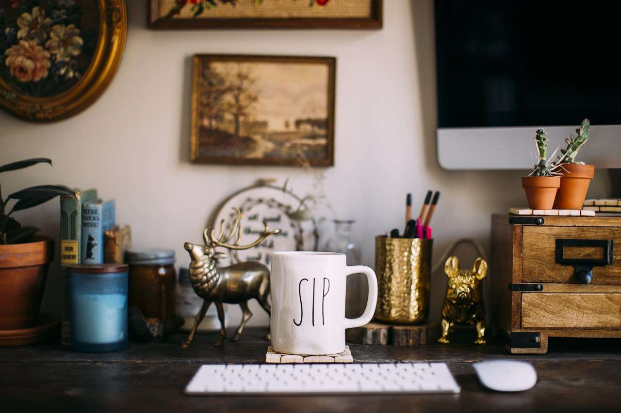 How I Became a Web Designer (And Built a Career I Love) | Westco Web Design Interior office space with framed artwork on the wall, a desk with a laptop, and warm-toned decor.