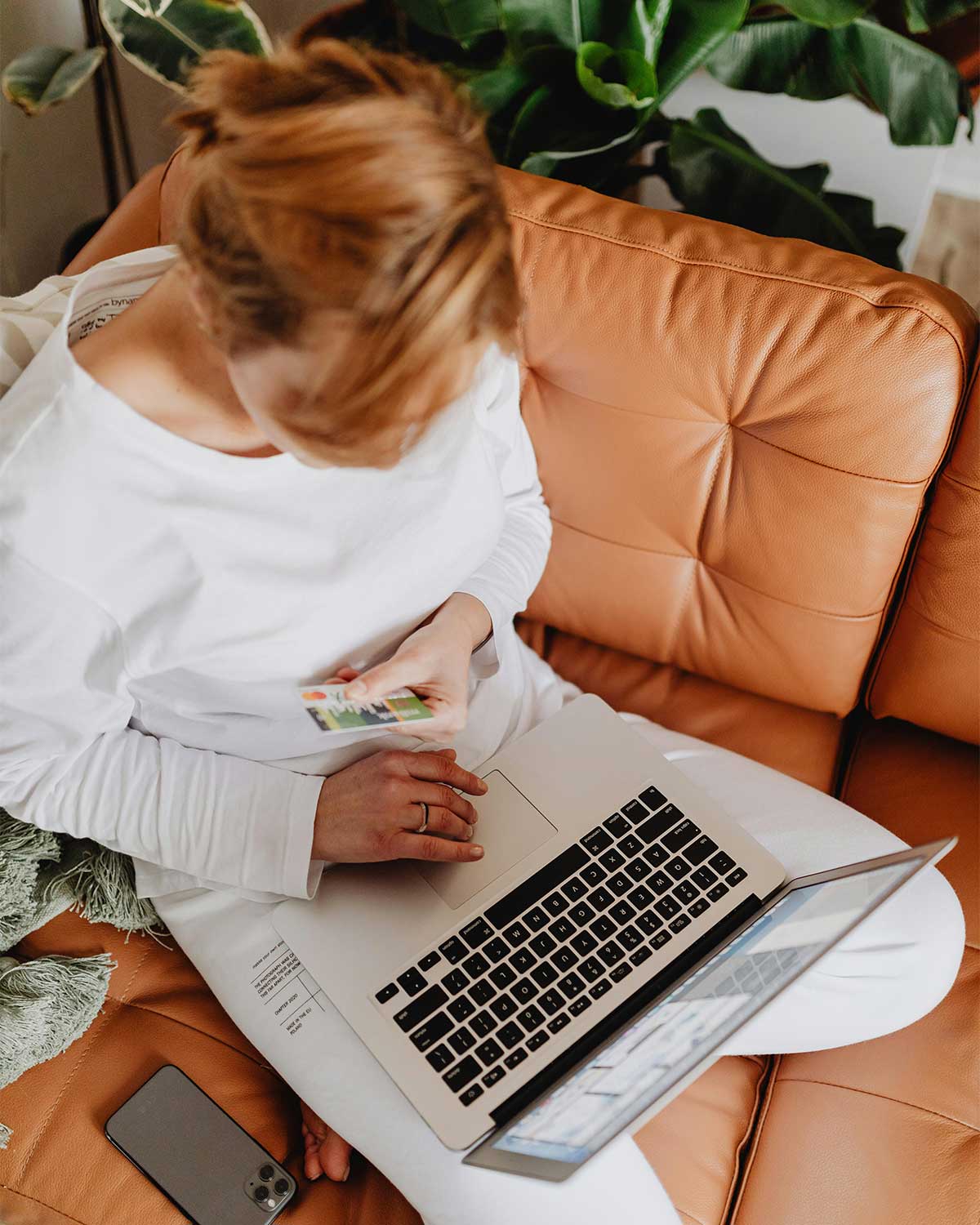 How to Create a Blog Strategy That Generates Leads for Your Small Business in 2026 | Westco Web Design Entrepreneur working on laptop while planning blog strategy for her business.