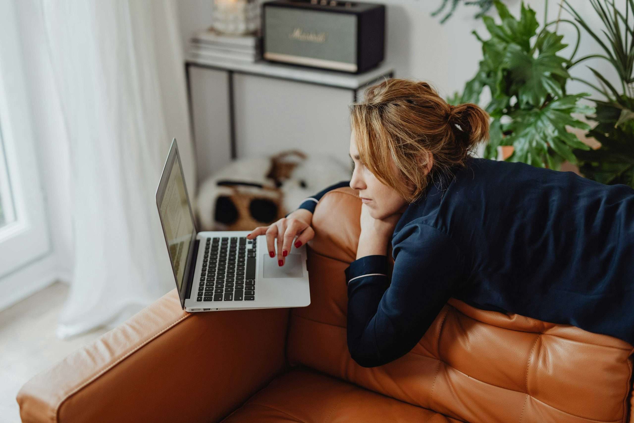 How to Create a Blog Strategy That Generates Leads for Your Small Business in 2026 | Westco Web Design Freelancer working from home on laptop creating content strategy for her blog.