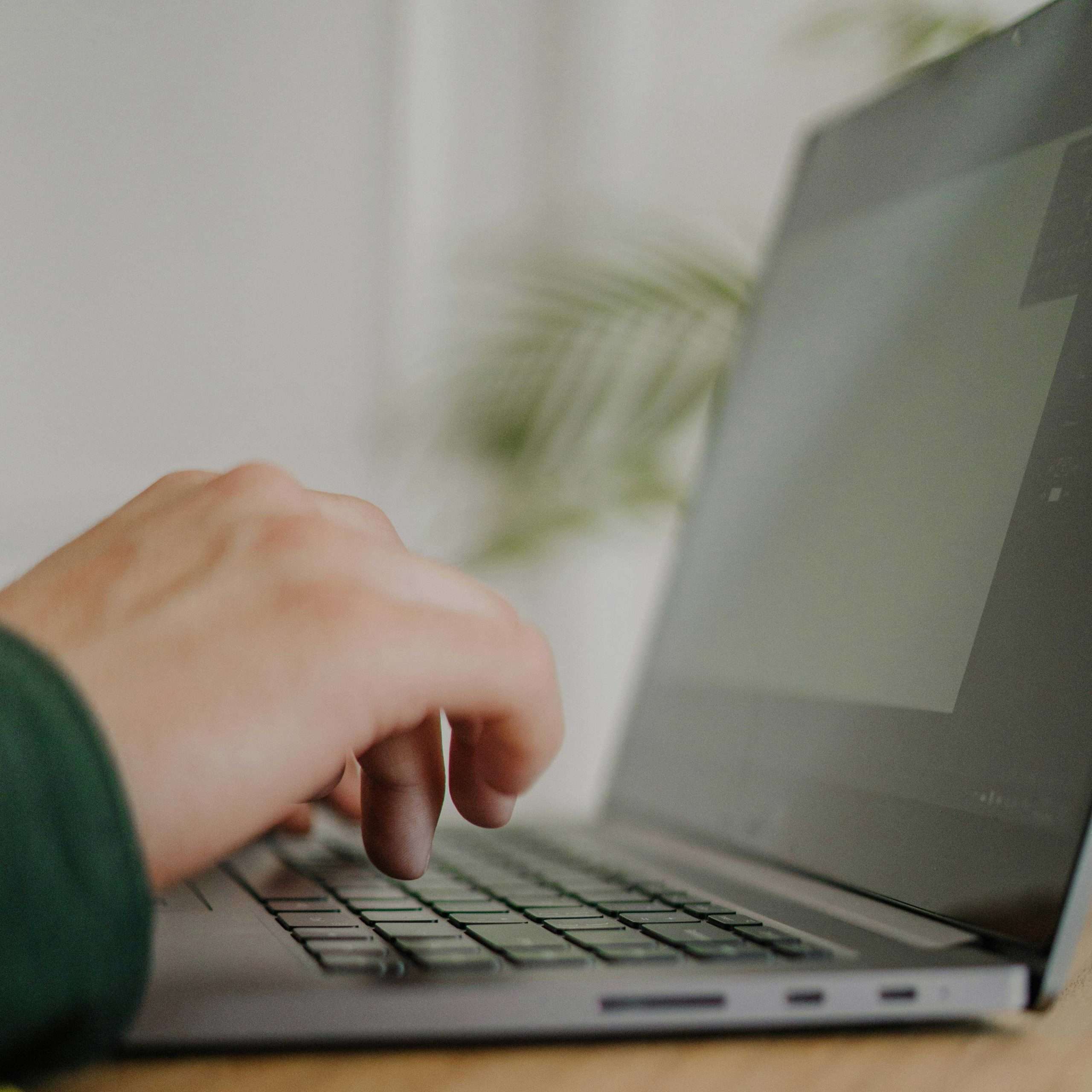 pexels-tima-miroshnichenko-4841642 Close-up of hand typing on laptop keyboard during a DIY SEO website audit.